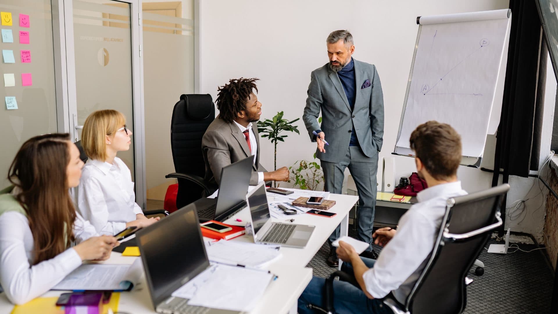 A Parousia Group colleague at work in an open-plan office